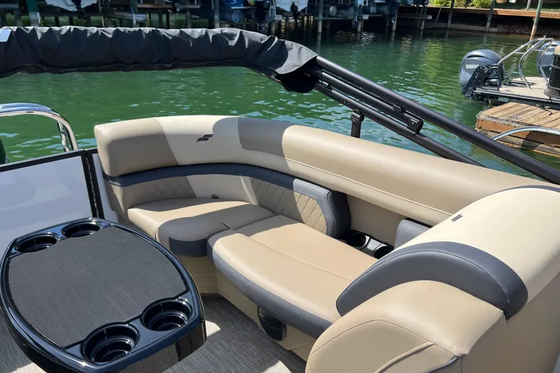 Slide: The Image of Luxurious seating on 2026 Starcraft EXS 3 R DH boat, featuring cup holders and elegant design. - 12