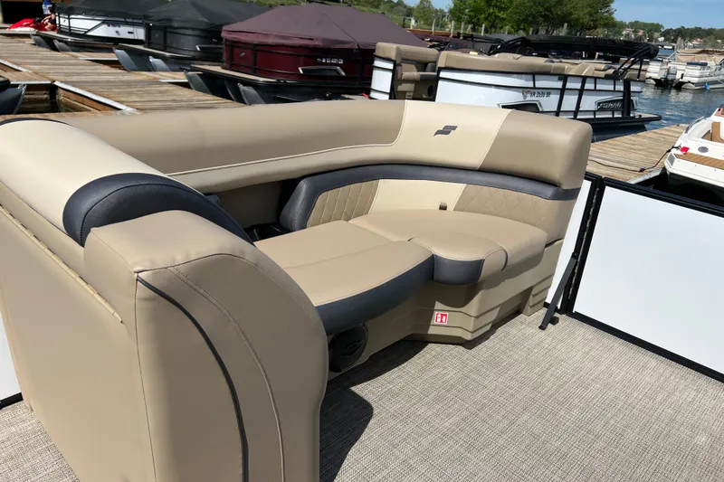Slide: The Image of Luxurious seating on a 2026 Starcraft EXS 3 R DH boat at a marina. - 4