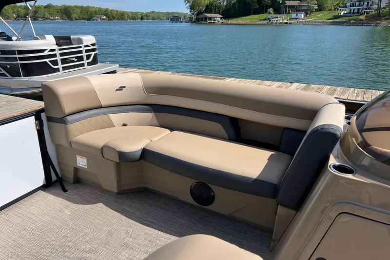 Slide: The Image of Luxurious seating on 2026 Starcraft EXS 3 R DH boat, docked by a serene lake. - 5