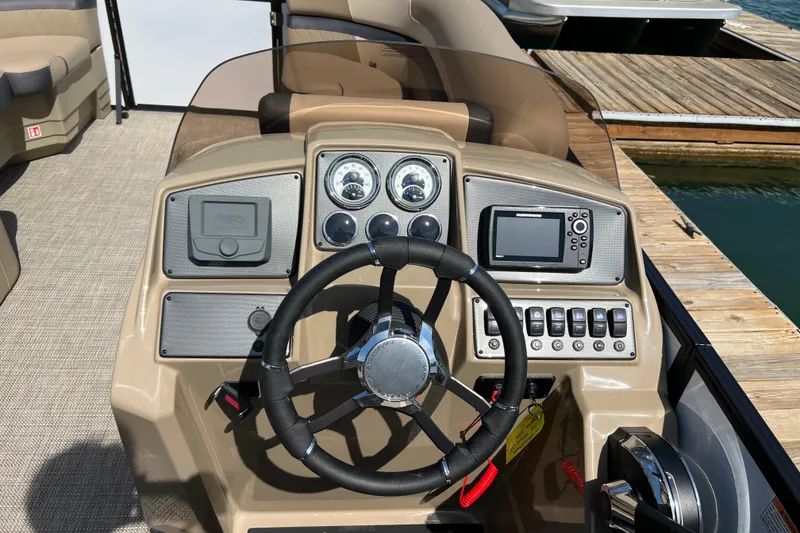 Slide: The Image of Steering console of 2026 Starcraft EXS 3 R DH boat with gauges and controls. - 7