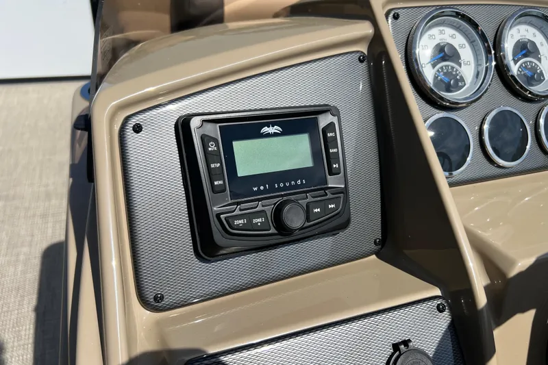 Slide: The Image of Dashboard of 2026 Starcraft EXS 3 R DH boat with audio system and gauges. - 8