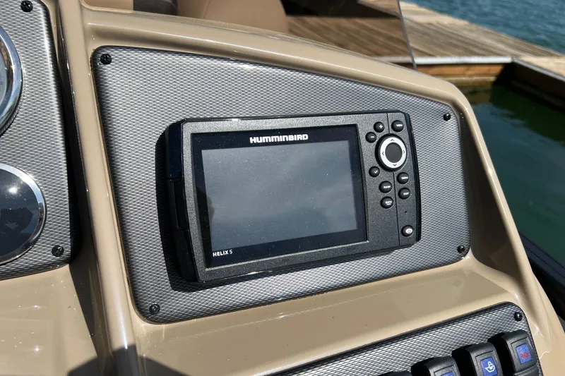 Slide: The Image of Humminbird Helix 5 fish finder on 2026 Starcraft EXS 3 R DH boat dashboard. - 9
