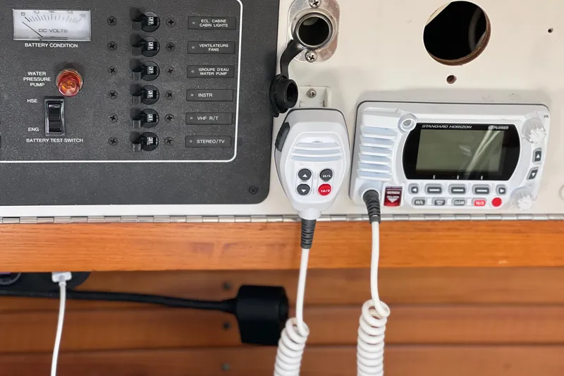 Slide: The Image of Control panel and radio equipment on a 1998 J Boats J/120 sailboat. - 12