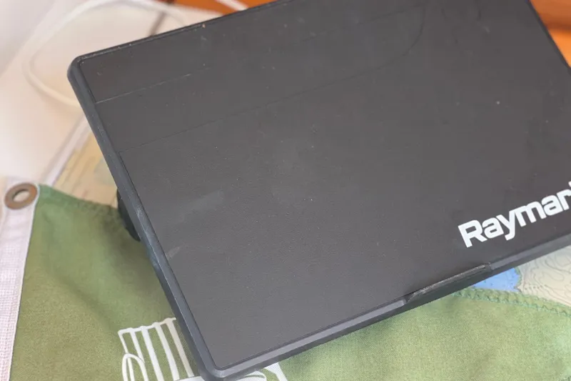 Slide: The Image of Raymarine device on J Boats J/120, 1998 model, with green fabric background. - 13