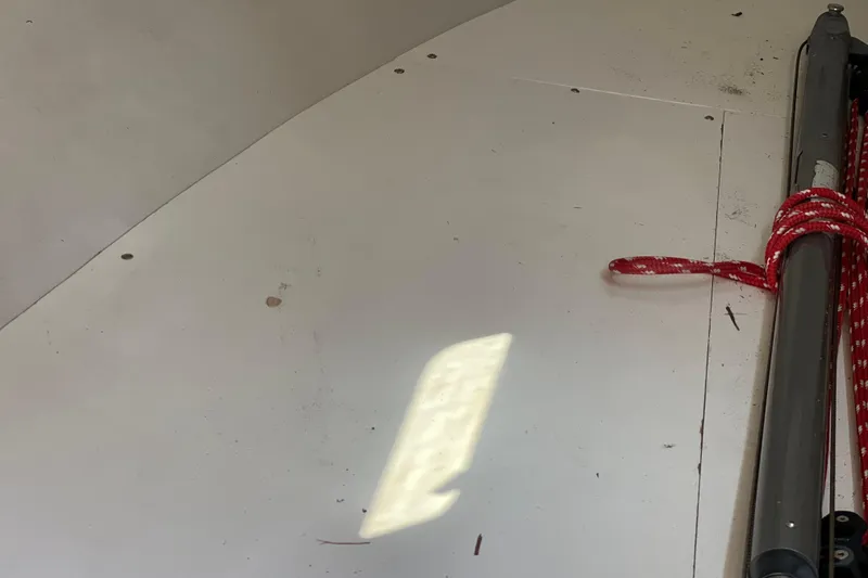 Slide: The Image of Interior view of a 1998 J Boats J/120 sailboat with red rope detail. - 9