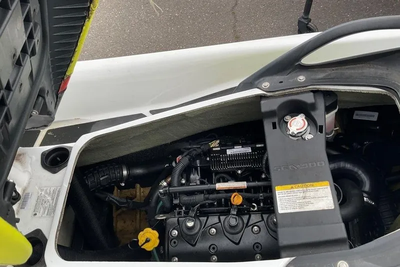 Slide: The Image of 2014 Sea-Doo Wake Pro 215 engine compartment, showcasing internal components and design. - 2