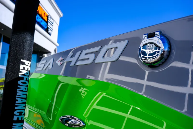 Slide: The Image of 2024 Supra SA 450 boat with vibrant green and gray design, showcasing performance features. - 10