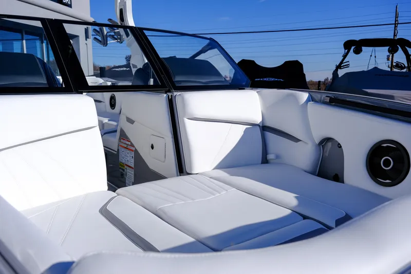Slide: The Image of Luxurious interior of 2024 Supra SA 450 boat with white seating and sleek design. - 11
