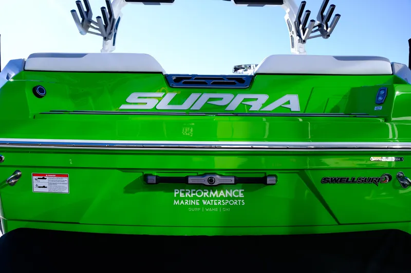 Slide: The Image of 2024 Supra SA 450 boat in vibrant green, featuring Swell Surf technology. - 12