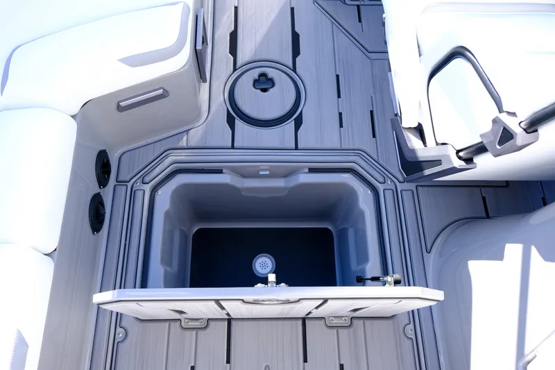 Slide: The Image of 2024 Supra SA 450 boat interior with open storage compartment and sleek seating. - 22