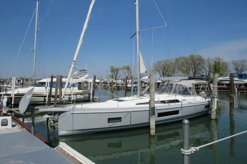 The Image of 2020 Beneteau Oceanis 46.1 sailboat docked in a marina under clear blue skies. - 0