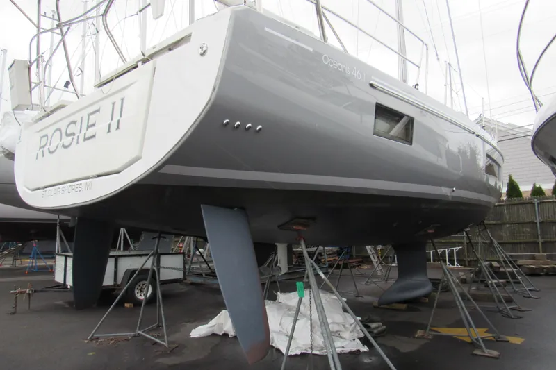 Slide: The Image of 2020 Beneteau Oceanis 46.1 sailboat on stands, gray hull, named "ROSIE II". - 12