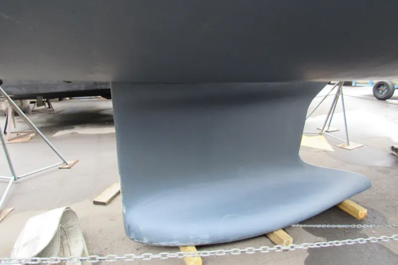 Slide: The Image of 2020 Beneteau Oceanis 46.1 keel on dry dock, supported by stands. - 13