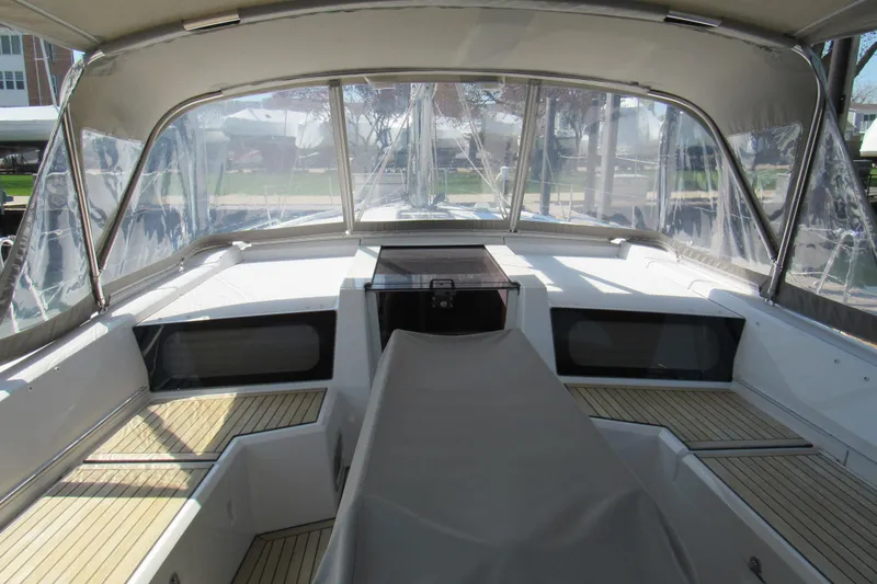 Slide: The Image of 2020 Beneteau Oceanis 46.1 yacht cockpit with covered seating and clear canopy. - 14