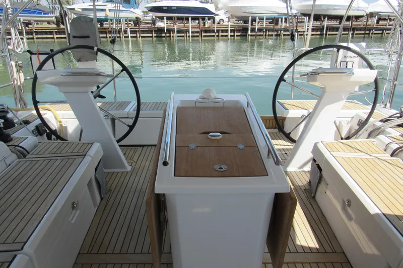 Slide: The Image of Cockpit of 2020 Beneteau Oceanis 46.1 yacht with dual steering wheels and teak decking. - 17