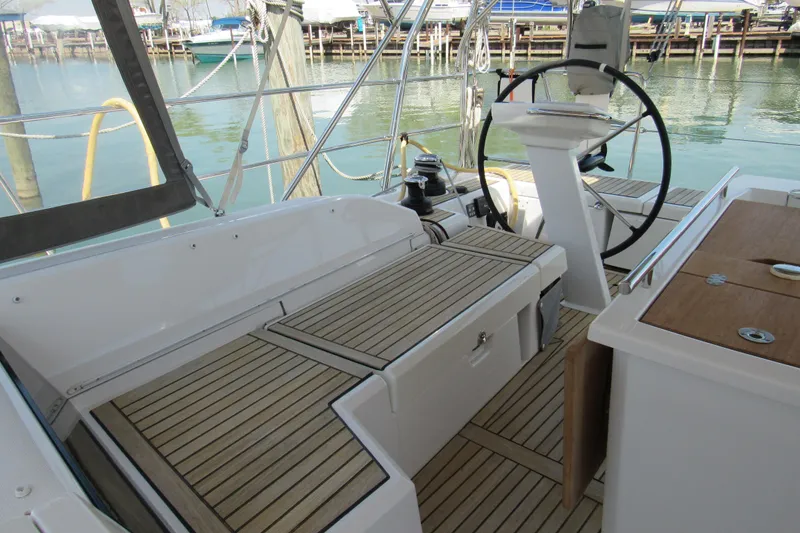 Slide: The Image of Cockpit of 2020 Beneteau Oceanis 46.1 yacht with wooden decking and steering wheel. - 18