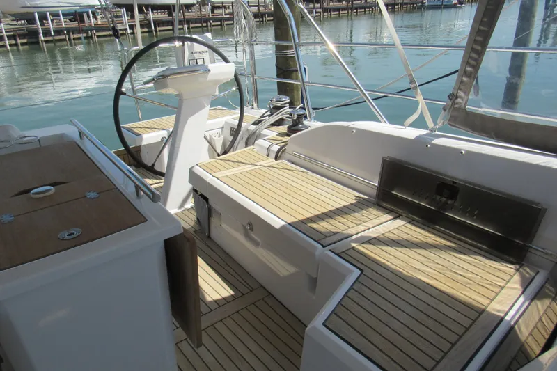 Slide: The Image of Cockpit of 2020 Beneteau Oceanis 46.1 yacht with wooden deck and steering wheel. - 19
