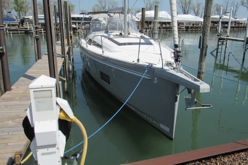Slide: The Image of 2020 Beneteau Oceanis 46.1 yacht docked at marina, side view. - 2