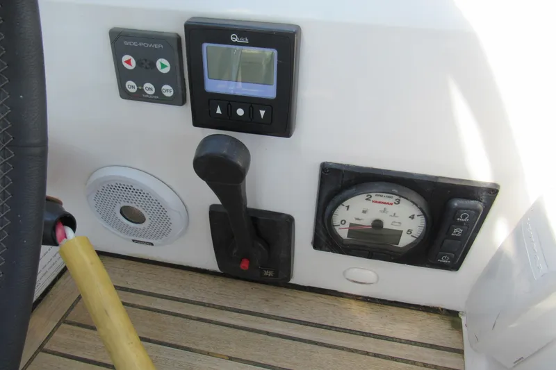 Slide: The Image of Control panel of a 2020 Beneteau Oceanis 46.1 sailboat with throttle and gauges. - 20