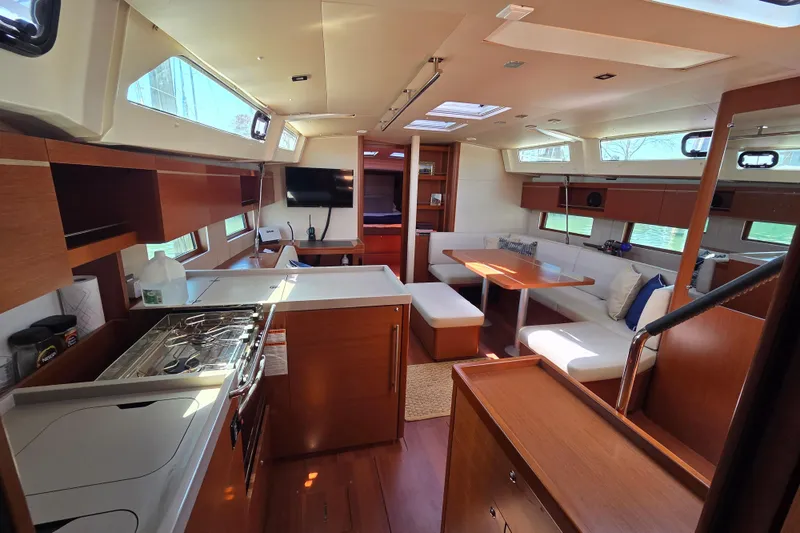 Slide: The Image of Luxurious interior of 2020 Beneteau Oceanis 46.1 yacht with modern kitchen and seating area. - 23