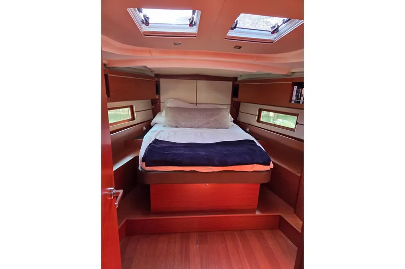 Slide: The Image of Luxurious cabin interior of 2020 Beneteau Oceanis 46.1 yacht with skylights and cozy bedding. - 26