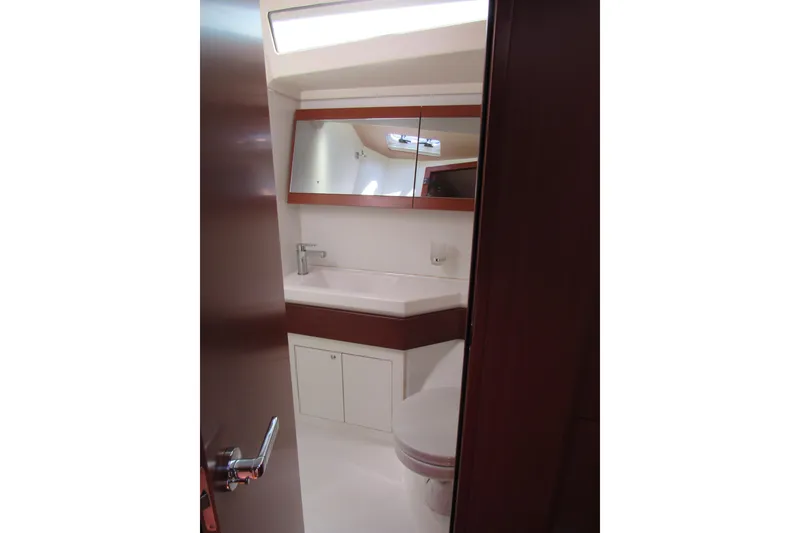Slide: The Image of Bathroom interior of 2020 Beneteau Oceanis 46.1 yacht, featuring modern fixtures and cabinetry. - 27