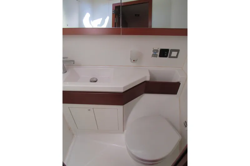 Slide: The Image of Bathroom interior of 2020 Beneteau Oceanis 46.1 yacht, featuring modern sink and toilet. - 28