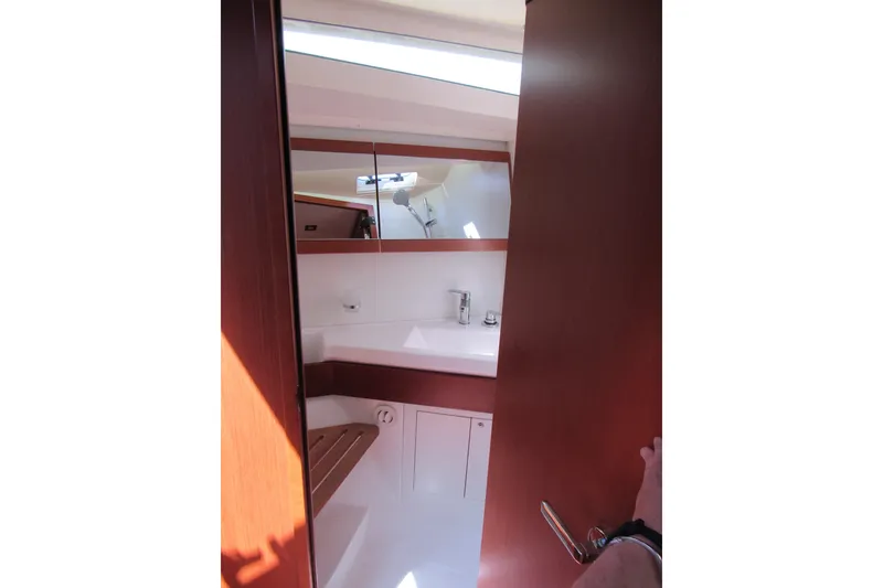 Slide: The Image of Interior view of 2020 Beneteau Oceanis 46.1 yacht bathroom with wooden finish. - 30