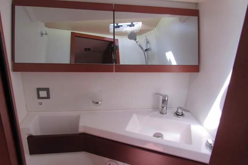 Slide: The Image of 2020 Beneteau Oceanis 46.1 yacht bathroom with modern sink and mirrored cabinet. - 31