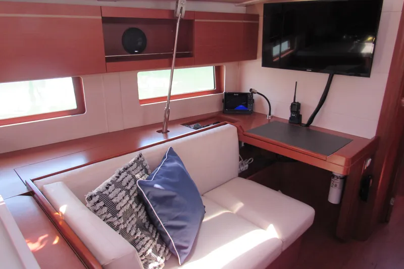 Slide: The Image of Interior of 2020 Beneteau Oceanis 46.1 yacht with cozy seating and modern navigation equipment. - 32