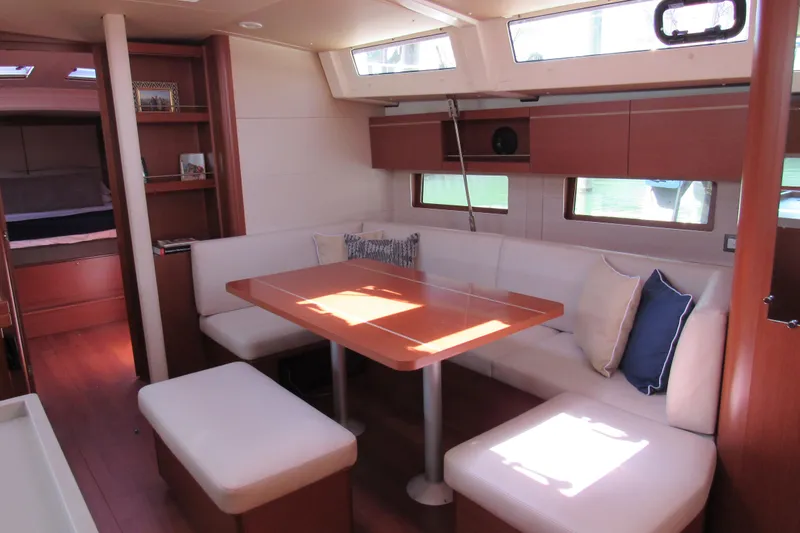 Slide: The Image of Interior of 2020 Beneteau Oceanis 46.1 yacht with cozy seating and dining area. - 34