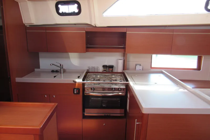 Slide: The Image of Modern kitchen interior of 2020 Beneteau Oceanis 46.1 yacht with stove and sink. - 35