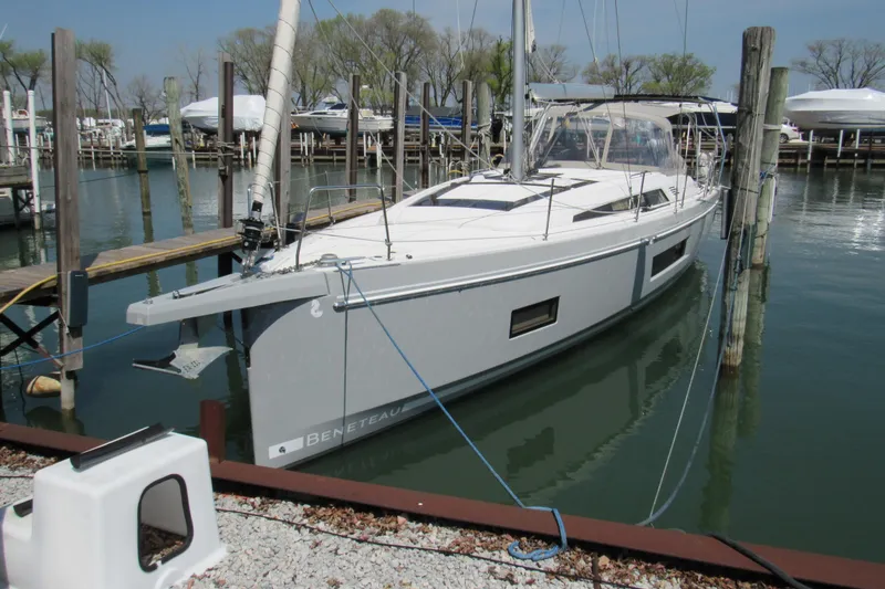Slide: The Image of 2020 Beneteau Oceanis 46.1 sailboat docked in a marina, showcasing sleek design and modern features. - 4