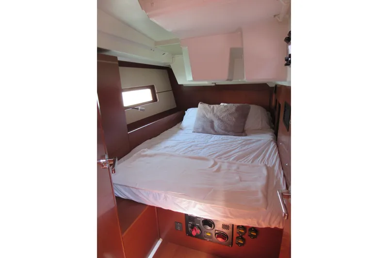 Slide: The Image of Cozy cabin interior of 2020 Beneteau Oceanis 46.1 yacht with comfortable bed and wooden finish. - 40