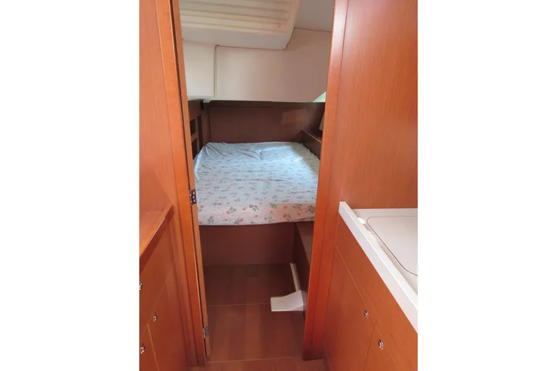 Slide: The Image of Interior cabin of 2020 Beneteau Oceanis 46.1 yacht with cozy bed and wooden finish. - 42