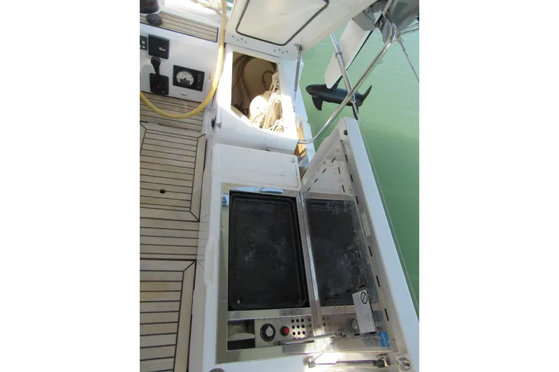 Slide: The Image of Beneteau Oceanis 46.1 (2020) yacht deck with built-in grill and storage. - 44