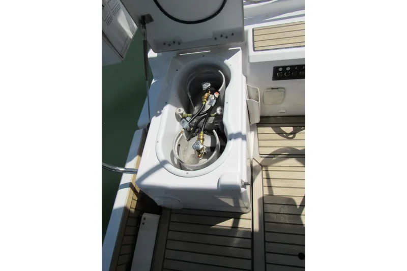 Slide: The Image of Beneteau Oceanis 46.1 (2020) yacht deck with open storage compartment. - 45
