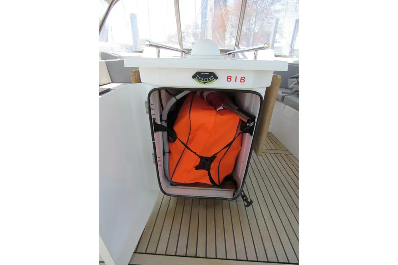 Slide: The Image of Storage compartment on 2020 Beneteau Oceanis 46.1 yacht with orange safety equipment. - 46