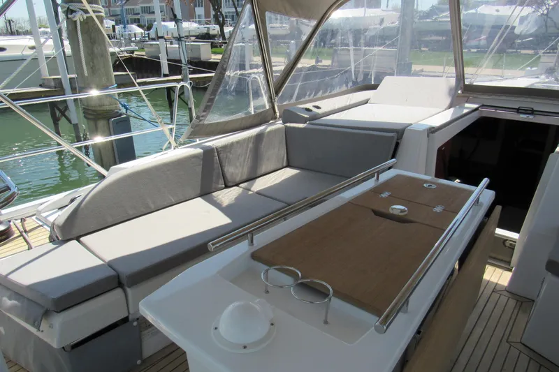 Slide: The Image of Beneteau Oceanis 46.1 yacht cockpit with seating and table, 2020 model. - 49