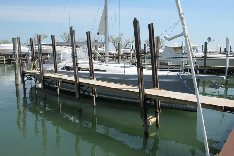 Slide: The Image of 2020 Beneteau Oceanis 46.1 yacht docked at marina, calm water reflection. - 5