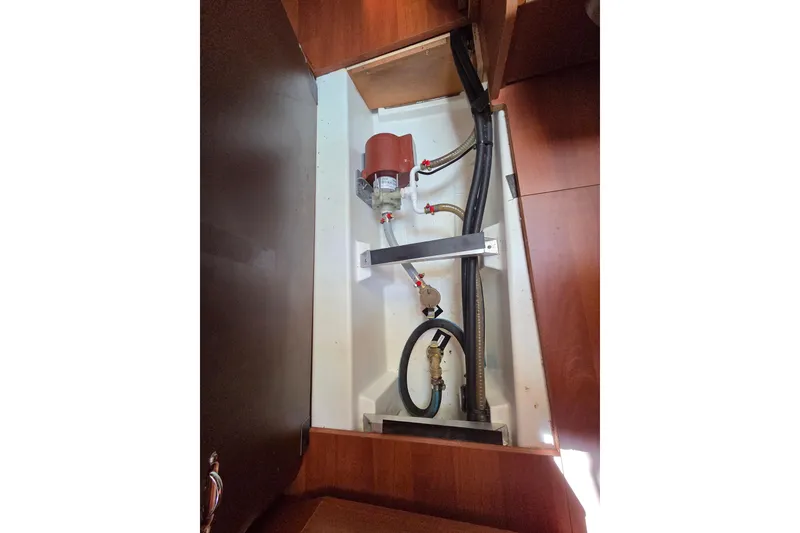 Slide: The Image of Interior view of 2020 Beneteau Oceanis 46.1 yacht showing plumbing and wiring components. - 54