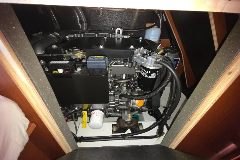 Slide: The Image of Engine compartment of a 2020 Beneteau Oceanis 46.1 sailboat, showcasing mechanical components. - 55