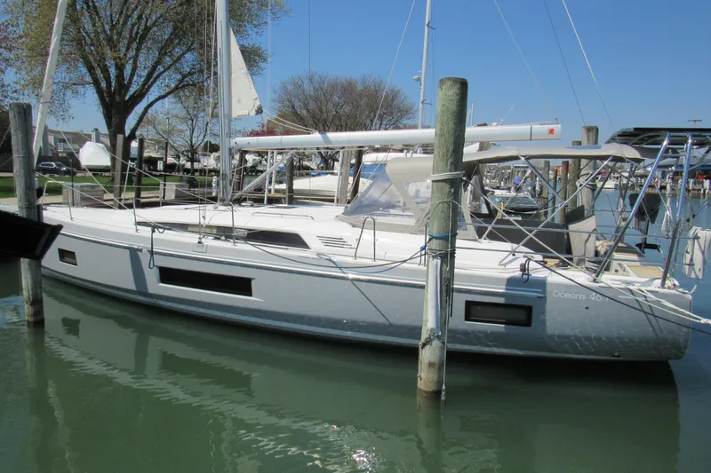 Slide: The Image of 2020 Beneteau Oceanis 46.1 sailboat docked in a marina, showcasing sleek design and modern features. - 6
