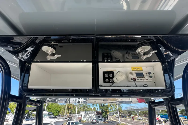 Slide: The Image of 2021 Key West 263 FS boat console with storage and electronic controls. - 26