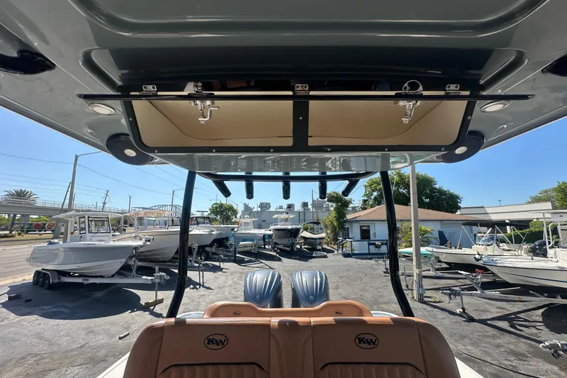 Slide: The Image of 2021 Key West 263 FS boat interior view at a marina with multiple boats. - 27