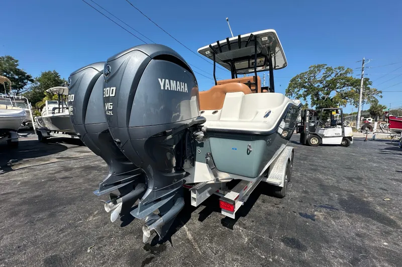 Slide: The Image of 2021 Key West 263 FS boat with dual Yamaha 300 V6 engines on a trailer. - 3