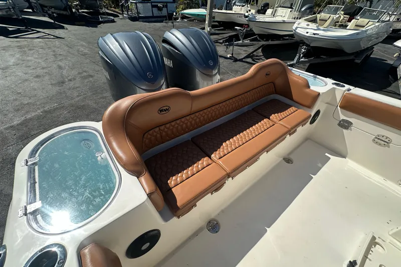 Slide: The Image of 2021 Key West 263 FS boat with tan seating and dual Yamaha engines. - 32