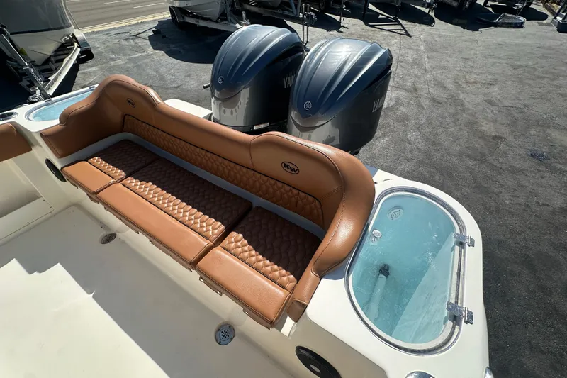Slide: The Image of 2021 Key West 263 FS boat with tan seating and dual Yamaha engines. - 33