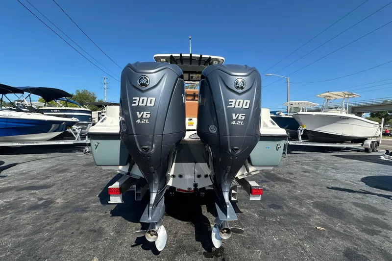 Slide: The Image of 2021 Key West 263 FS boat with dual Yamaha 300 V6 4.2L outboard engines. - 4