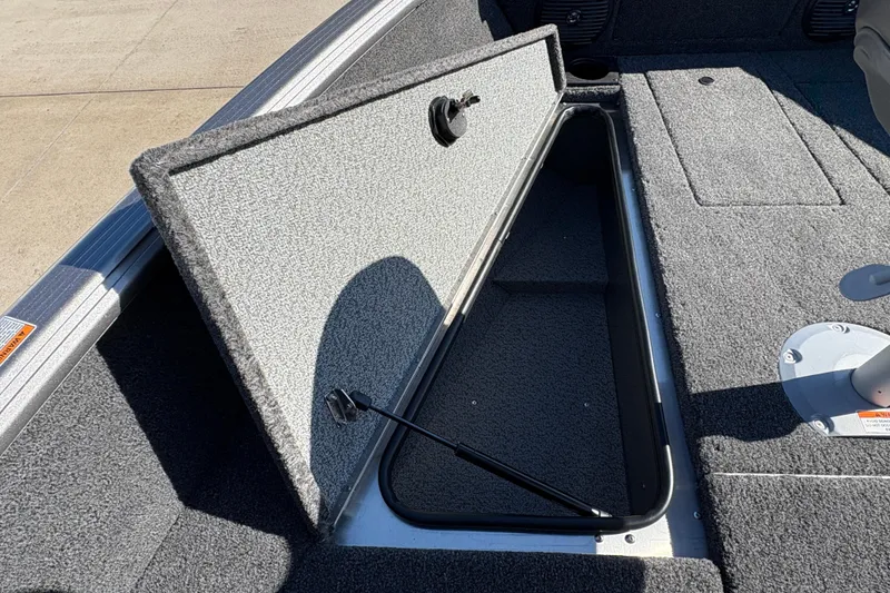 Slide: The Image of Open storage compartment in 2026 Lund 1875 Impact XS Sport boat. - 10